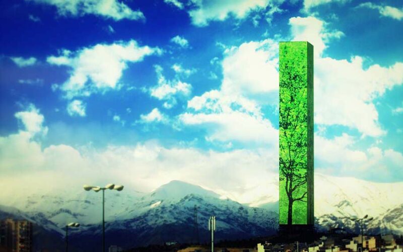 Tall green slab tower with a tree printed on its face, standing in front of snow-covered mountains under a bright blue sky with clouds